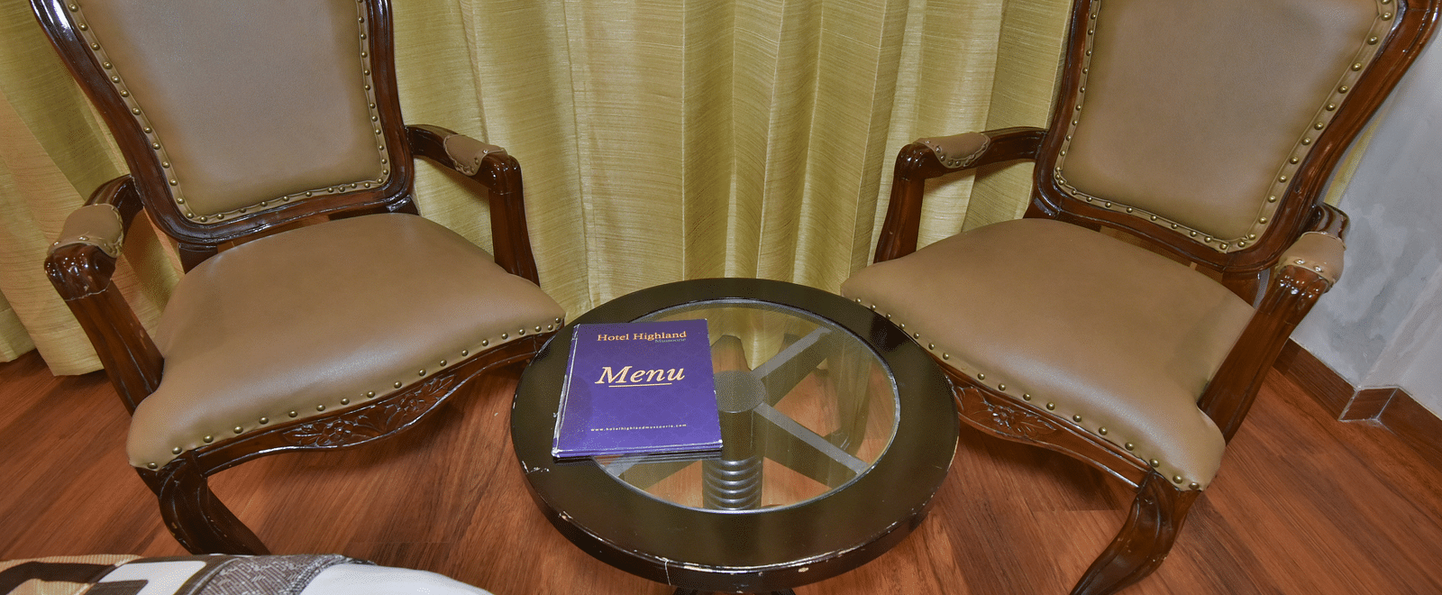 Two comfortable chairs in the Deluxe Room at DLS Highland Resort and Spa, Mussoorie.